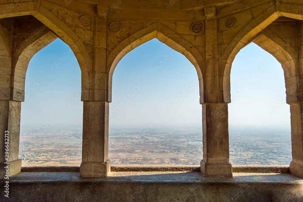 Flying buttresses are one of the most iconic features of Gothic architecture style of masonry building characterized by cavernous spaces with the expanse of walls broken up by overlaid tracery . flying butters