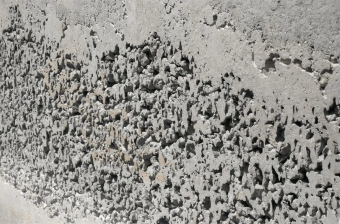 Concrete honeycombing refers to large voids and cavities left in concrete structures resembling a honeycomb shape. concrete honeycombing