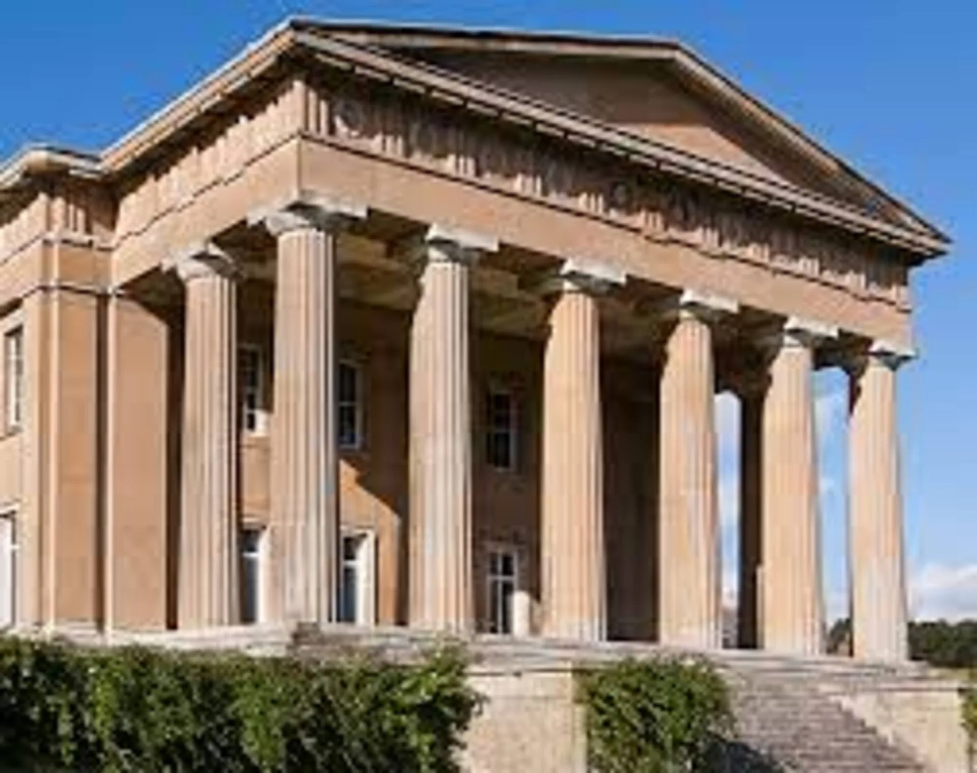 Fluted columns are concrete or steel columns featuring vertical indentations or concave grooves along their exterior surface resembling a stack of flutes. fluted column architecture